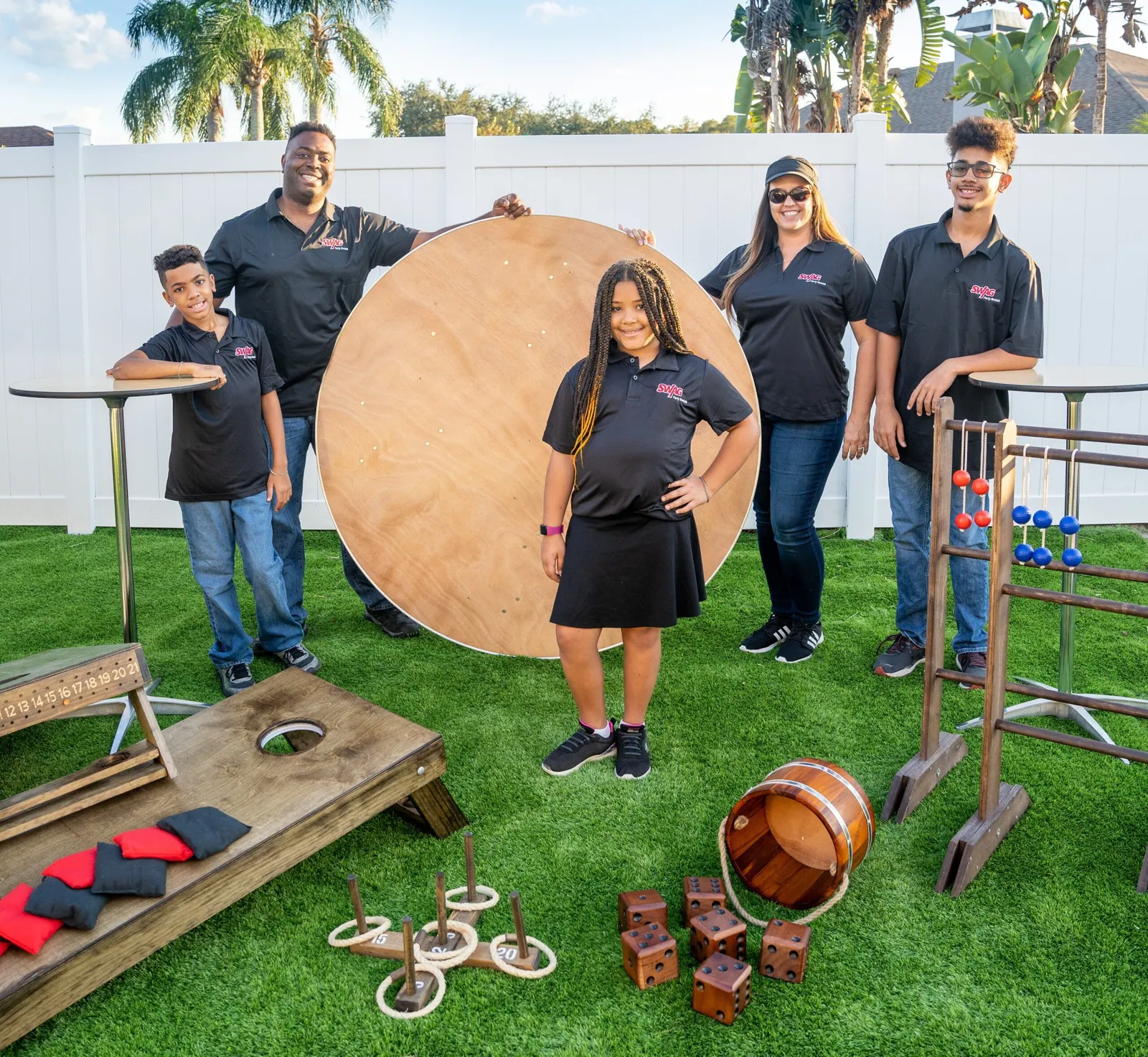 Anthony and Lindsay Williams, owners of SWAG Party Rentals, with their kids